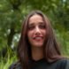 Outdoor portrait of mixed race Indian woman standing outdoors. Close up.